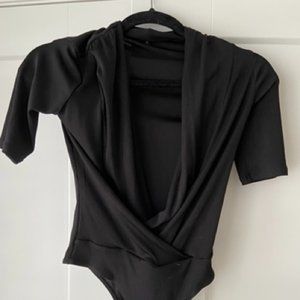 Lightly worn body suit with sleeves